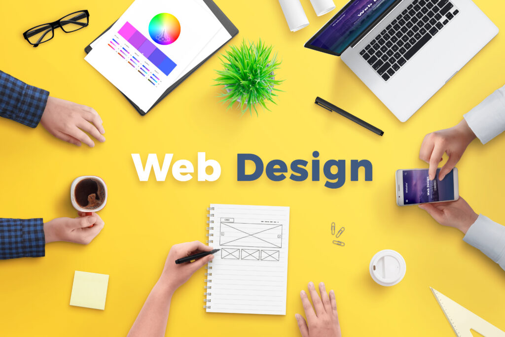 web-design-team-work-project-concept-yellow-desk-with-web-design-text-top-view-flat-lay-1024x684 تصميم المواقع والمتاجر الألكترونية